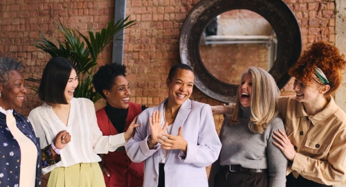 A group of women chatting and laughing