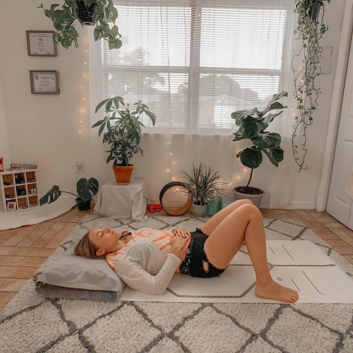 Instagram image of female doing yoga on the floor