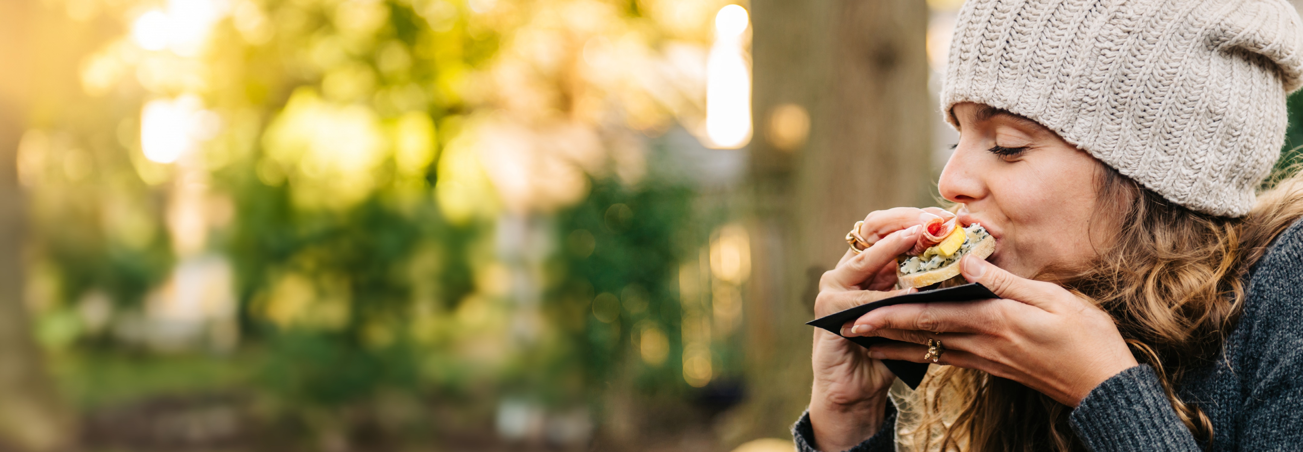 woman eating sandwich