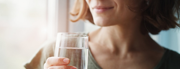 woman closeup drinking glass of water