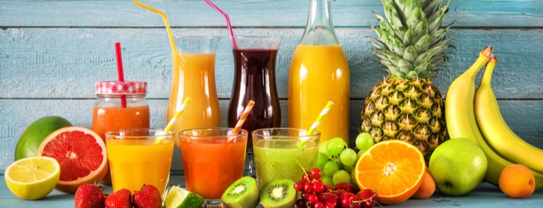 selection of fruit juices and fresh fruit