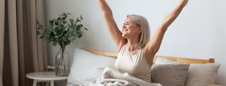 mature woman stretching happy 