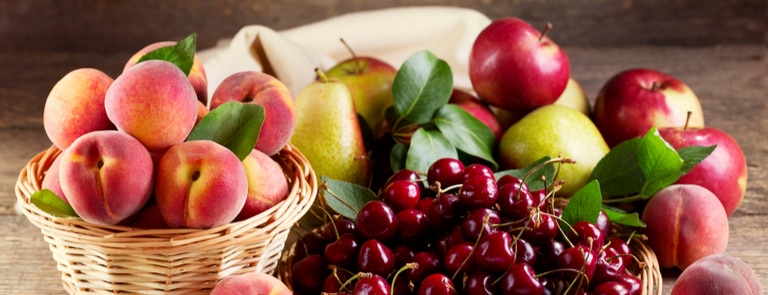 cherries apples pears and plums in basket