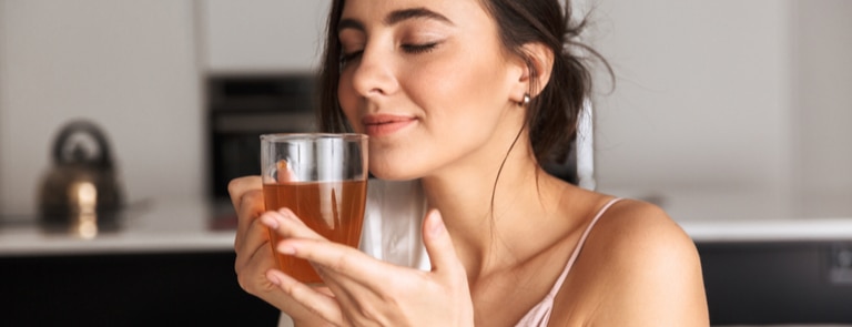 slim woman drinking herbal tea