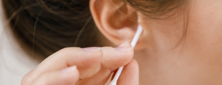 Causes and risks of dark ear wax image