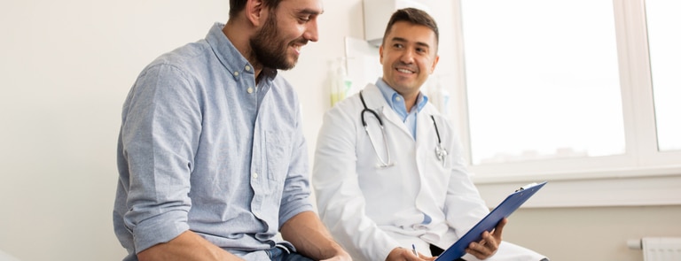 man sat discussing options at the doctors