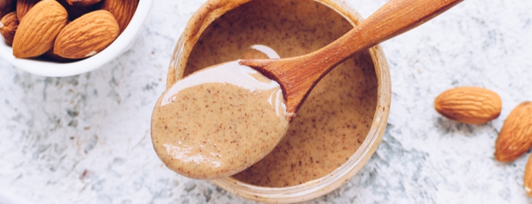 almond butter in wooden bowl 