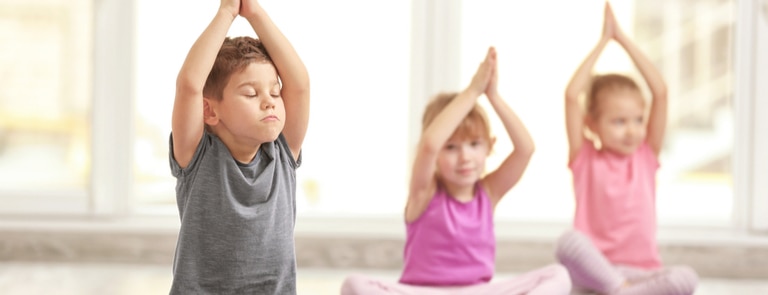 children doing yoga to relieve stress