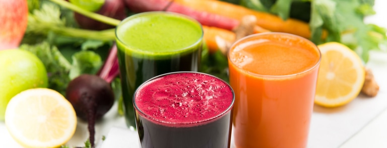 glasses of different fruit and vegetable juices for juice cleanse diet