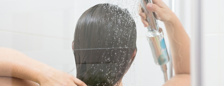 woman washing their hair 