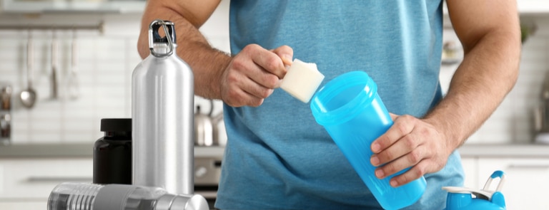 man using a protein shake