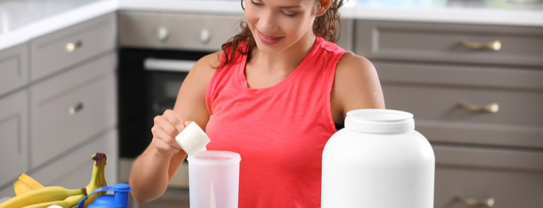 women making a protein shake for breakfast 