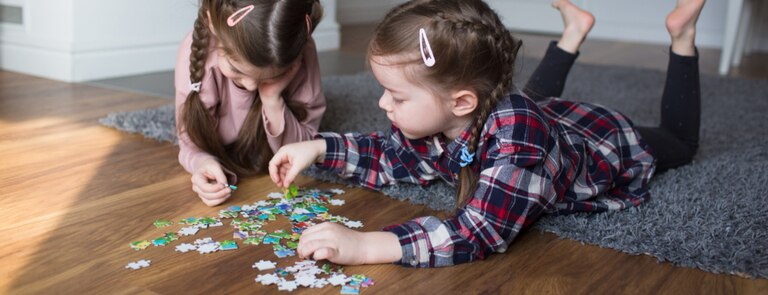 children doing a puzzle