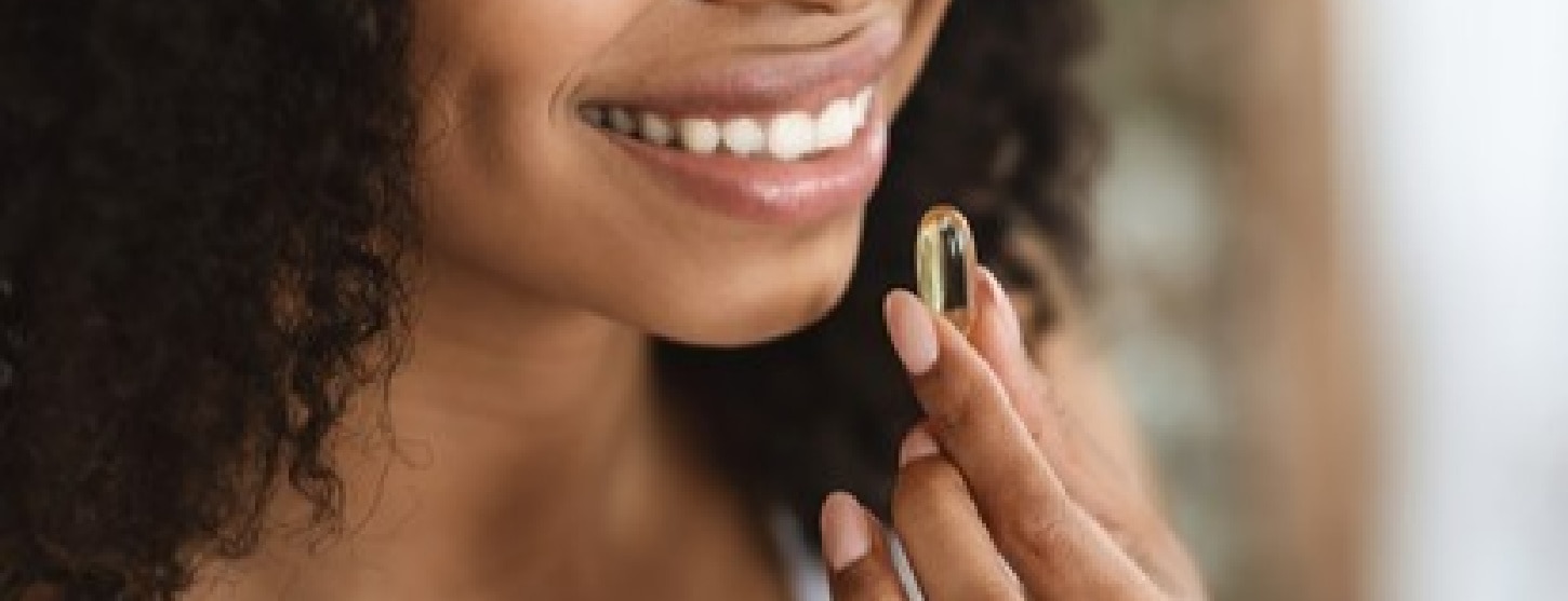 woman taking a vitamin