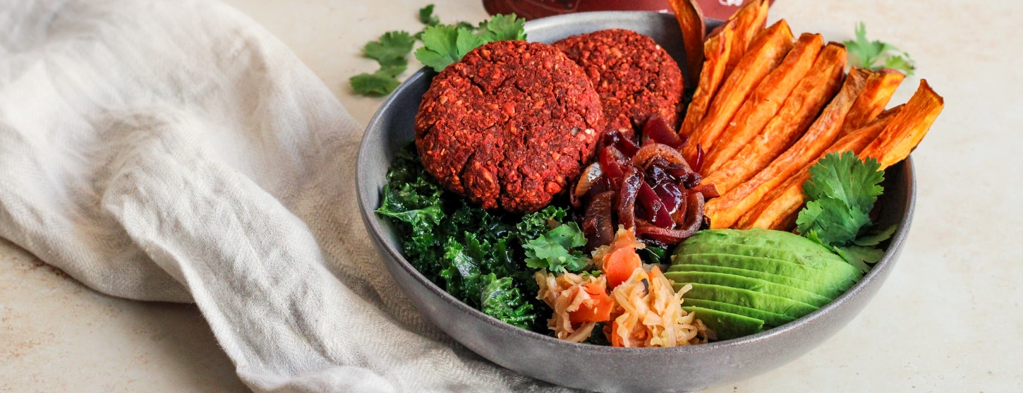This vegan burger bowl is packed with flavour and full of nutrients. Served with sweet potato chips, avocado and sauerkraut, it's a filling and tasty recipe perfect for lunch or dinner. 