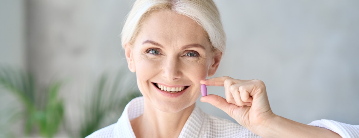middle aged woman in menopause taking perimenopause supplements