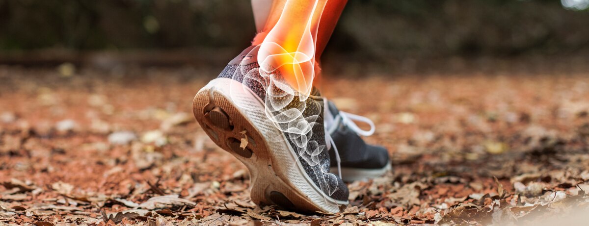 runners foot on forest floor with bone outline highlighted
