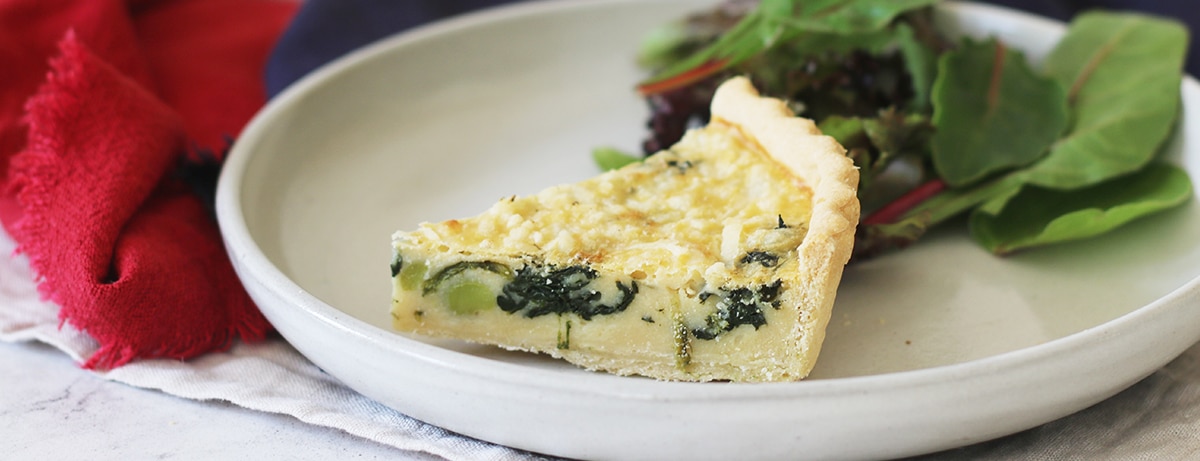 coronation quiche in a bowl with spinach 