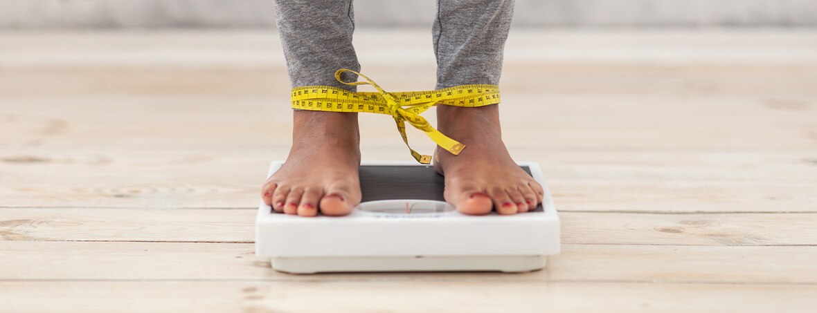 person standing on scales