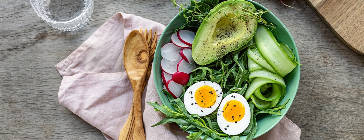 A selection of keto diet foods including avocado, nuts and oils