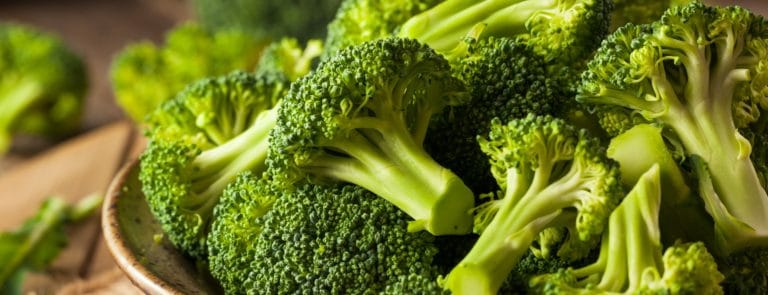 Close up of broccoli stalks in a bowl