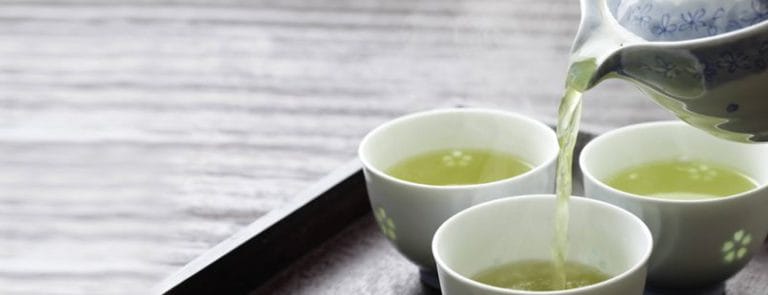 A Kettle Pouring Out Green Tea