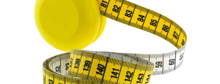 A yellow and white tape measure