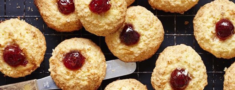 Coconut and millet biscuits with a cherry on top