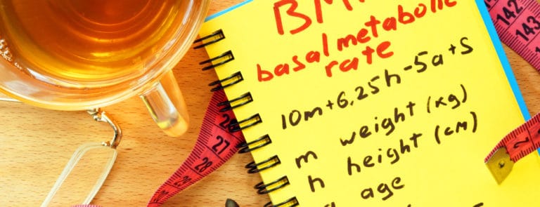A notepad with BMR or basal metabloic rate written on it