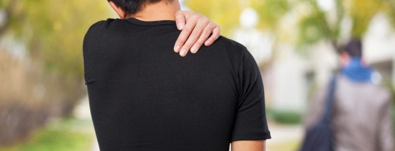man suffering a back ache