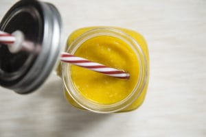 Yellow smoothie in mason jar