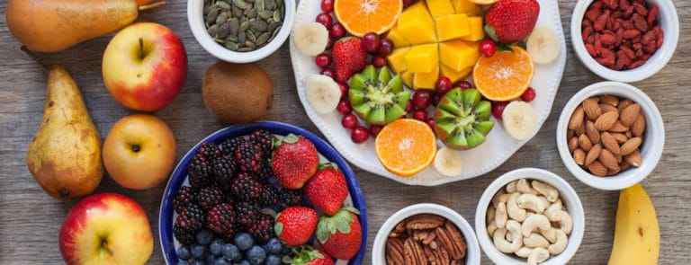 Vegan breakfast: variety of fruits, nuts and berries