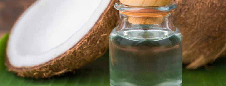 glass bottle of coconut oil
