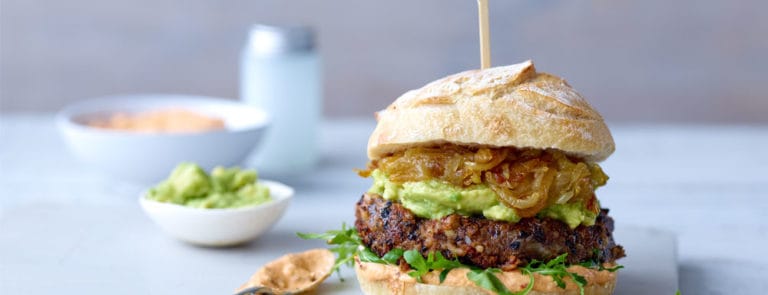 Vegan burger in bun made from black beans, rice and tofu