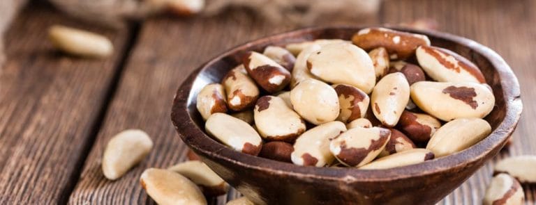 Wooden bowl of brazil nuts