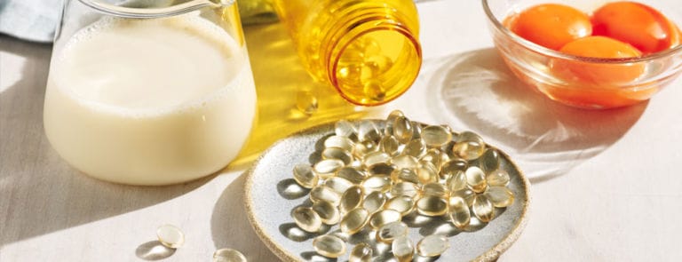 Holland & Barrett original image of Vitamin D sources. Milk, eggs and supplements.