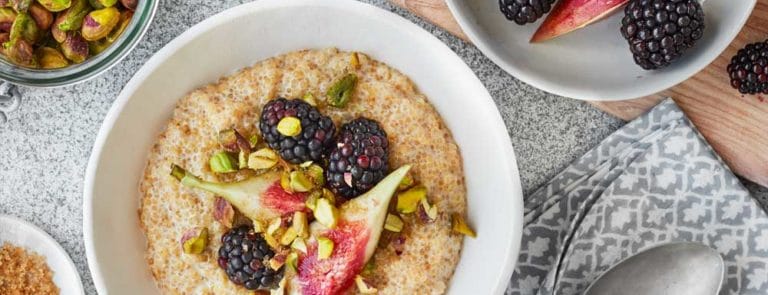 Blackberry and fig quinoa porridge with pistachios