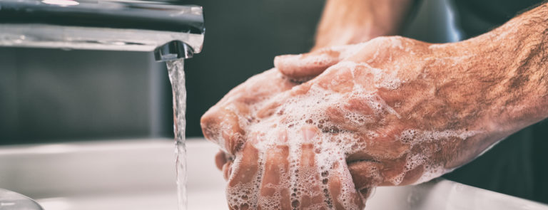 male washing hands