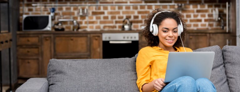 woman listening to music while working to increase productivity
