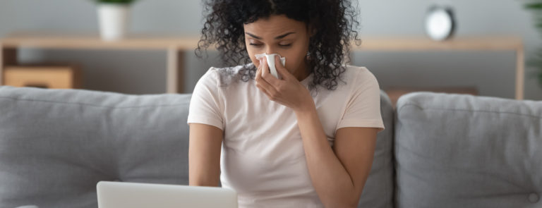 a woman struggling with a blocked nose