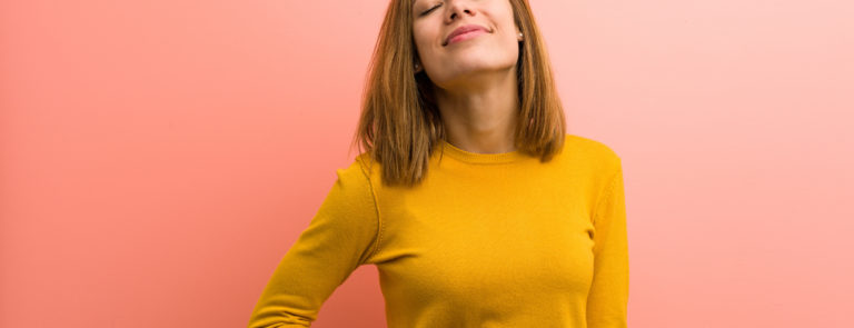 woman happy holding her tummy looking healthy
