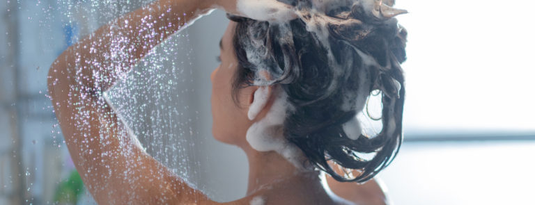 woman shampooing her dry hair