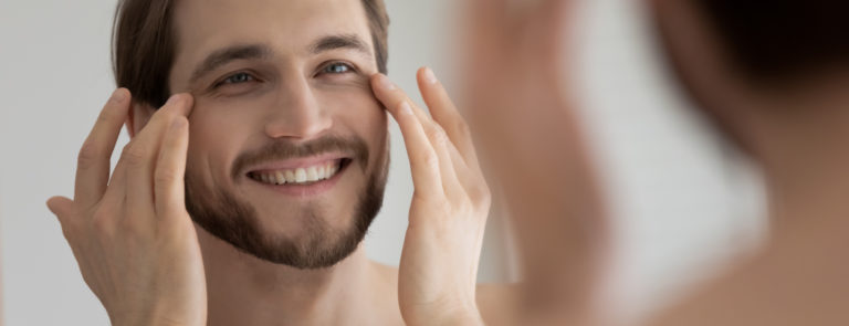 man applying the best eye cream for men