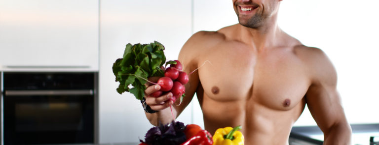 muscular man with vegetarian foods